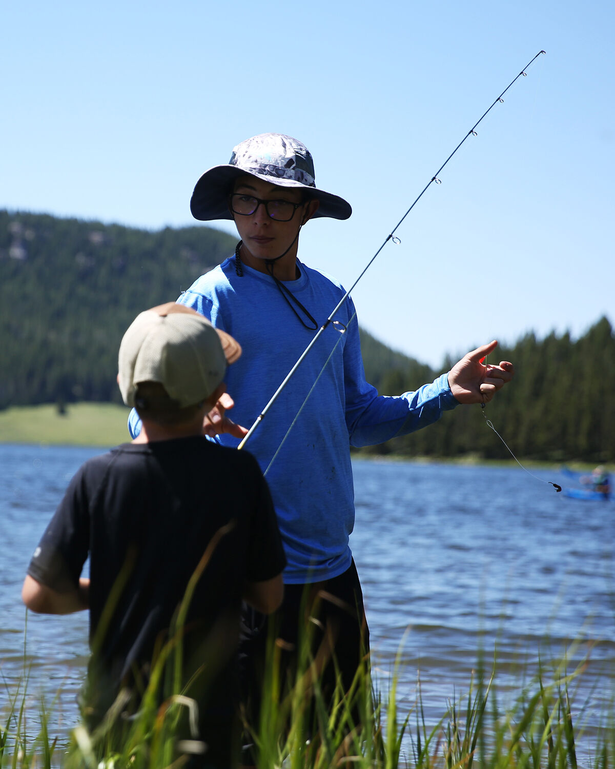 Kason Kukuchka helps adjust the bait